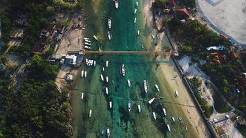 Drone view of a bridge connecting two islands over a narrow ocean channel. Nusa Lembongan and Nusa Ceningan in Indonesia. video