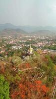 Aerial view of Buddhist temple on the hill in the city of Luang Prabang, Laos video
