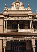A building with ornate balconies and a clock on the front photo