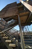 a stairway leading to a building with a metal railing photo