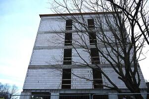 a tall building with a tree in front of it photo