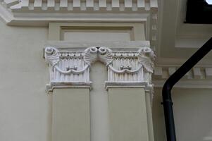a white column with decorative designs on it photo