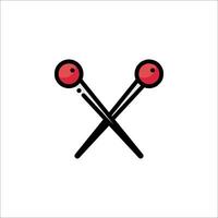 Two crossed sticks with red balls on them vector