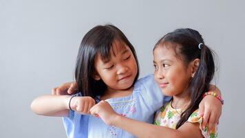 Fist Bump Friends Deal Partner Touch Pair Hands. Elementary students greet each other Trust in Team Giving Fist Bump to Greeting Say Hello or Say goodbye on weekends. photo