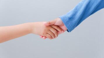 Children's handshake. Friendship concept. Friendly handshake, friends greeting, teamwork. photo