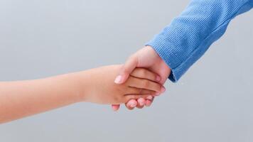 Children's handshake. Friendship concept. Friendly handshake, friends greeting, teamwork. photo