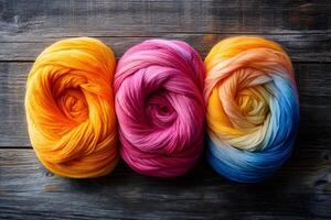 Vibrant Yarn Balls on Rustic Wooden Background for Crafting and Design photo