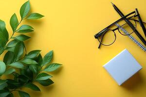 Modern Workspace Design with Greenery on Vibrant Yellow Background photo