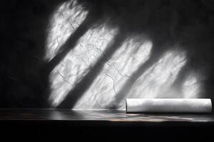 Minimalist Sunlit Shadow Patterns on Textured Wall with Rolled Paper photo
