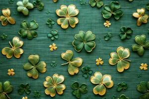 Embroidered four-leaf clovers forming repeating pattern on green fabric photo