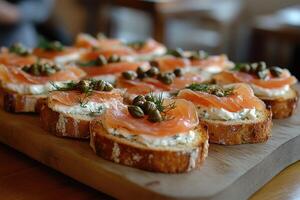 Delicious smoked salmon with cream cheese, capers, and dill on toasted baguette slices photo
