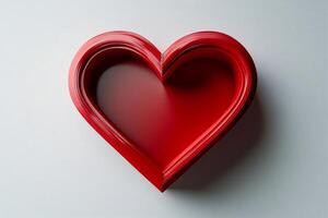 Red heart shape emerging from concentric layers on white background photo