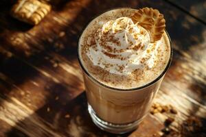Creamy coffee milkshake decorated with whipped cream and cookie on wooden table photo