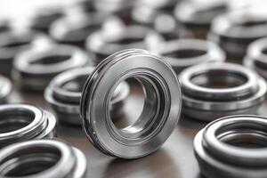Mechanical component standing out from group of identical metal parts photo