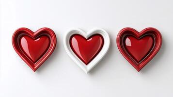 Three red hearts with white frame on white background representing love and affection photo