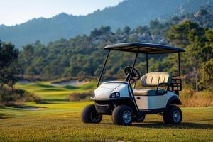 Golf cart parked on a beautiful golf course with mountain views at sunset photo