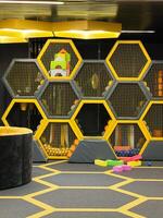 Modern indoor playground area with vibrant colors and hexagonal design pattern photo