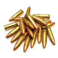 Collection of golden ammunition casings resting on a surface with a focus on detail and texture photo