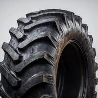 Close-up view of a rugged tractor tire showcasing deep treads and robust design suitable for rough terrains photo