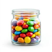 Colorful candy jar filled with vibrant chocolate treats in a glass container on a white background photo