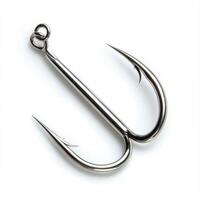 Detailed view of a metallic fishing hook with sharp barbs designed for catching fish effectively photo