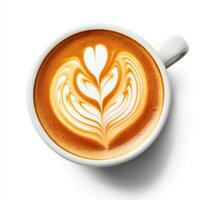 Creamy latte art with heart design in a white cup placed on a light background photo