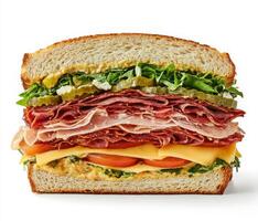 Delicious layered sandwich with fresh ingredients and a variety of meats made on whole grain bread photo