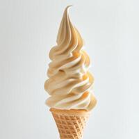 Creamy soft serve ice cream in a waffle cone against a light background showcasing its smooth texture and inviting swirl photo