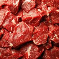 Fresh cuts of beef arranged in a rich red display at a local butcher shop for customers to choose from photo