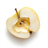Freshly sliced yellow apple with visible seeds showing its inner structure photo