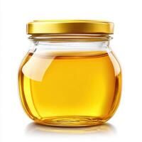 Glass jar filled with golden honey showcasing its texture and color on a clean background photo