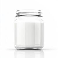 Glass jar filled with fresh milk sits on a clean white surface in a bright kitchen photo