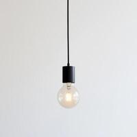 Stylish hanging light fixture enhances modern interior design in a minimalist setting photo