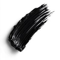 Thick black paint swatch spread on a white surface showcasing texture and shine photo