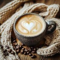 Warm coffee cup placed on a knitted scarf surrounded by coffee beans in a cozy setting in the afternoon light photo