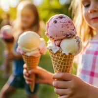 Children enjoy colorful ice cream cones in a sunny park during a summer afternoon gathering with friends photo