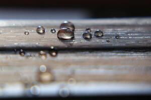 Hydrophobic surface of impregnated wood with water drops photo