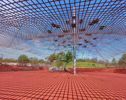 Under the safety net of a climbing playground in a German city photo