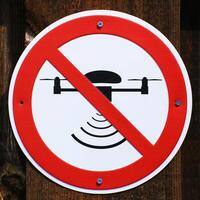 Drones forbidden - sign on a wooden wall in Germany photo