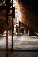 Old and abandoned attic of a big building photo
