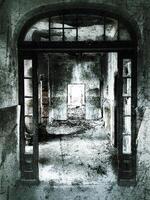 Creepy and grungy shot of corridor in an abandoned building photo