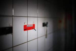 Note on wall in an empty tiled room with the German word Speisenauslieferung - food distribution photo