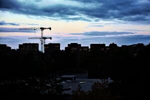 Sunset reflecting in windows of apartment blocks, high contrast shot in the evening photo