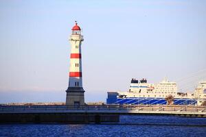 Lighthouse, bridge and ferry at harbor of Malmo in Sweden photo