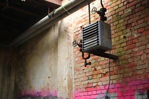 Rusty heating system in an abandoned factory building photo