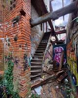 Useless stairs in a collapsed and abandoned building photo