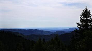Mountainous landscape layers stretch across the horizon in the Thuringian forest photo