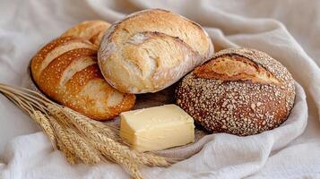 Artisan bread and butter on a linen cloth photo