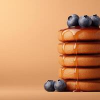 Stack of pancakes with blueberries and syrup photo