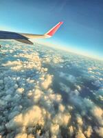 Dubai, UAE, 2024 - A View from airplane window, fling over clouds photo